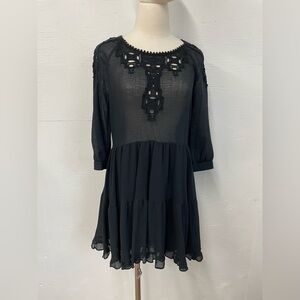 Free People size small dress with cotton motifs.